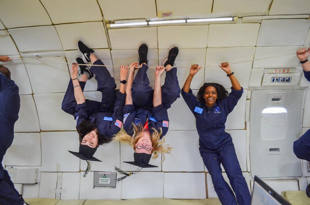 Students float upside down during their zero-g flight.